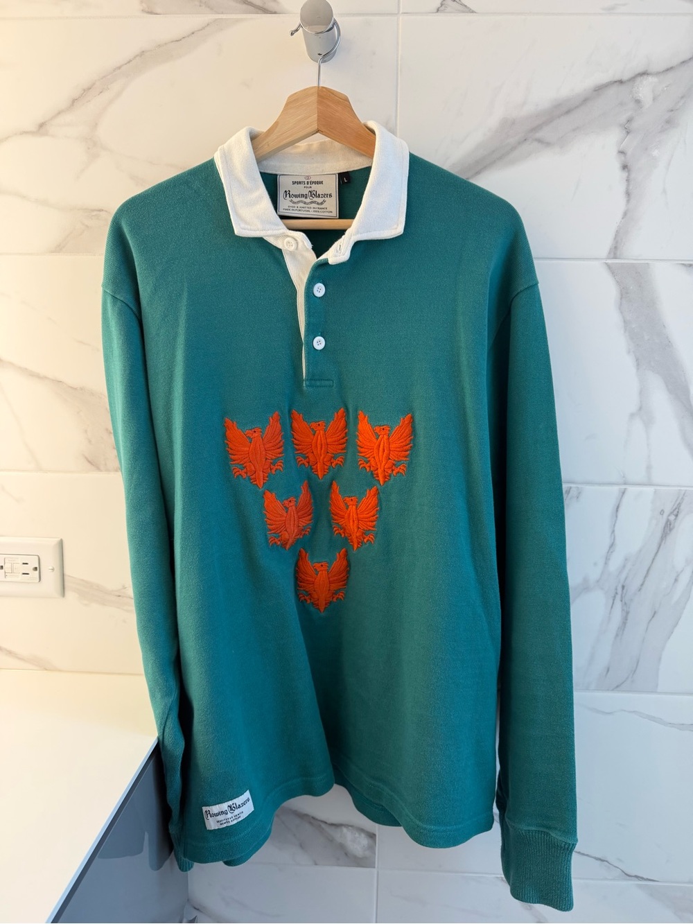 Rowing Blazers Teal Rugby Shirt with Orange Embroidered Motif
